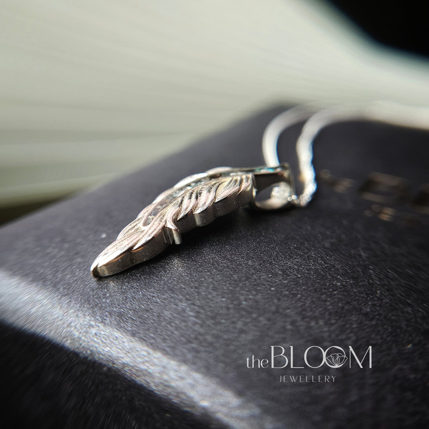 Feather necklace with ashes