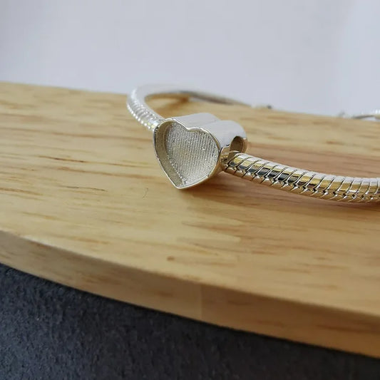 heart charm with ashes