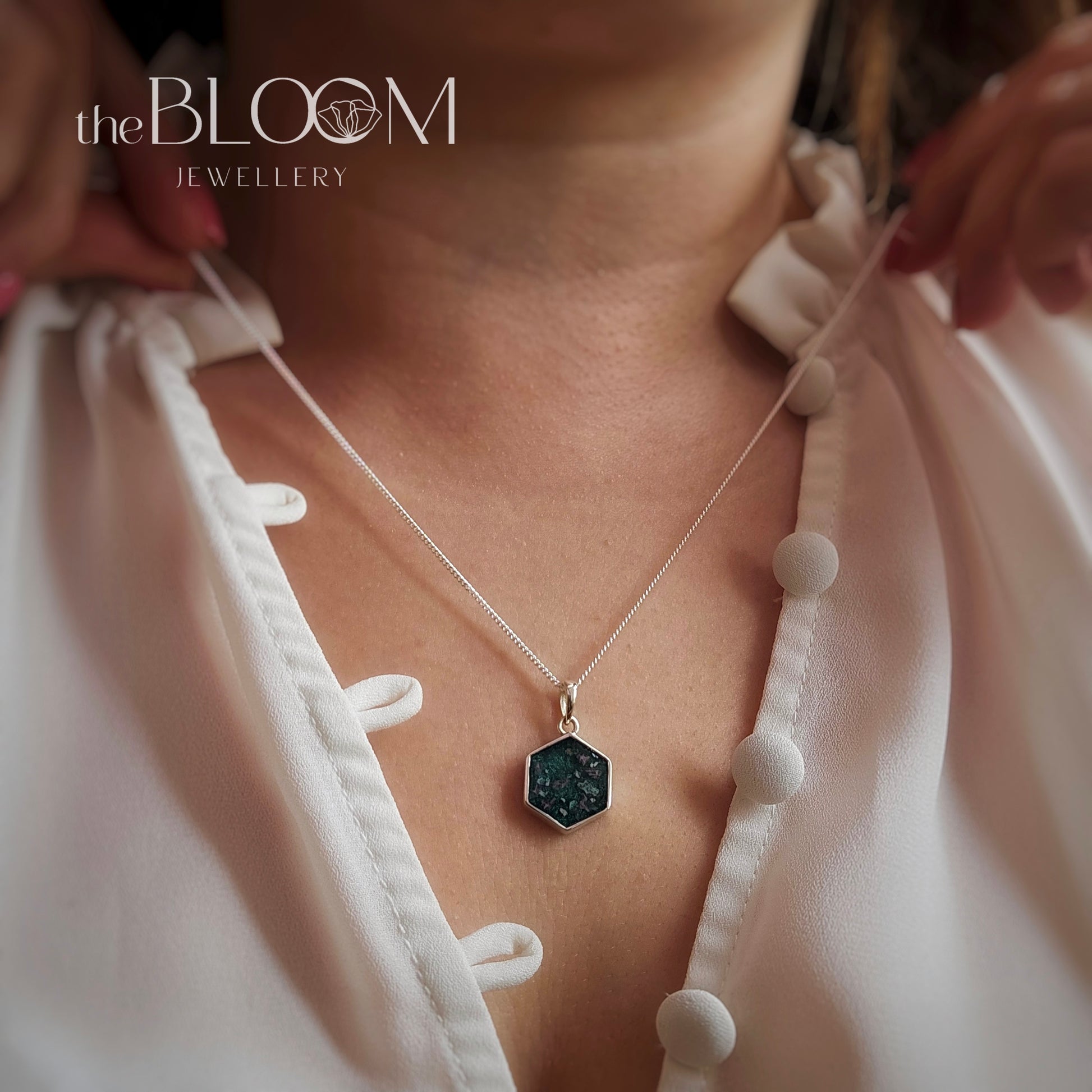 silver pendant with ashes