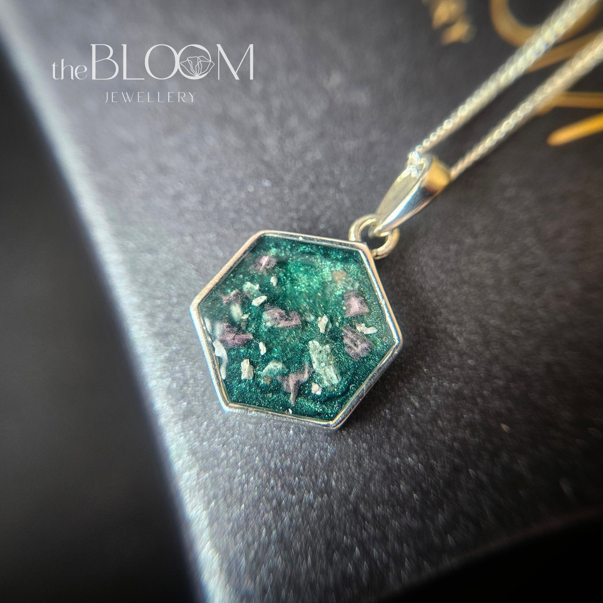 silver pendant with ashes