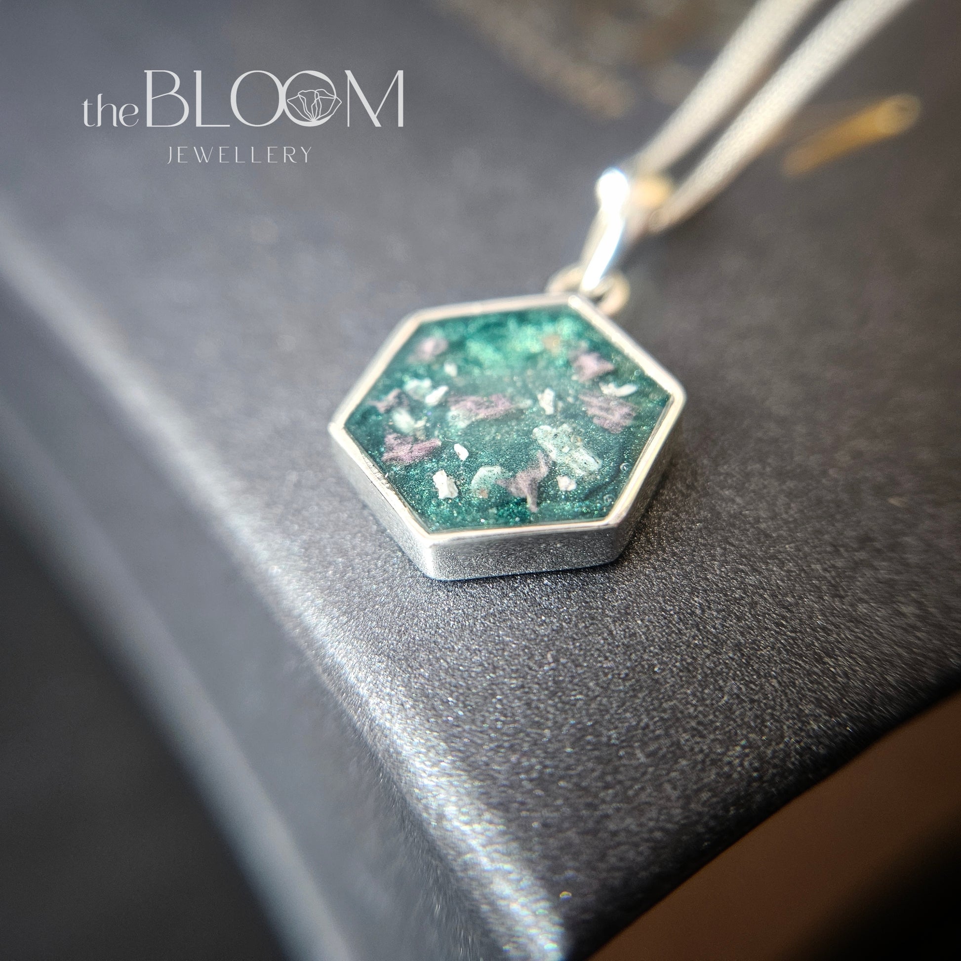 silver pendant with ashes