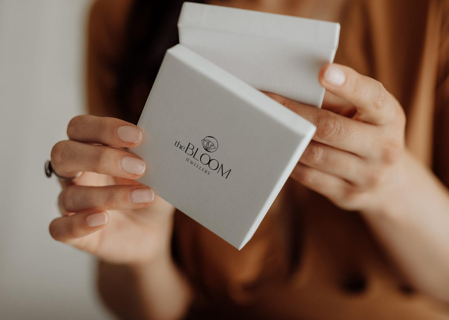 women holding memorial jewellery box