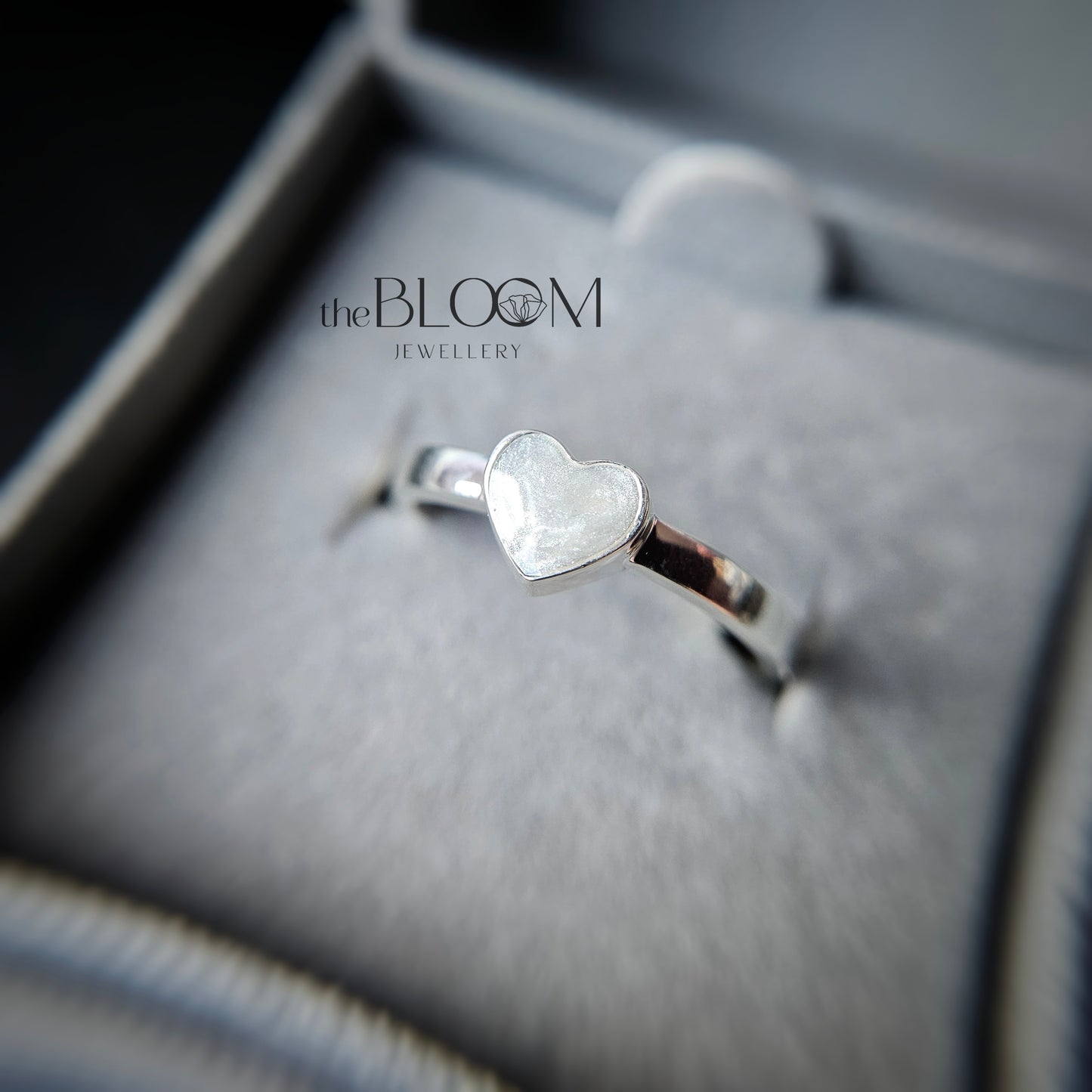 silver heart ring with ashes