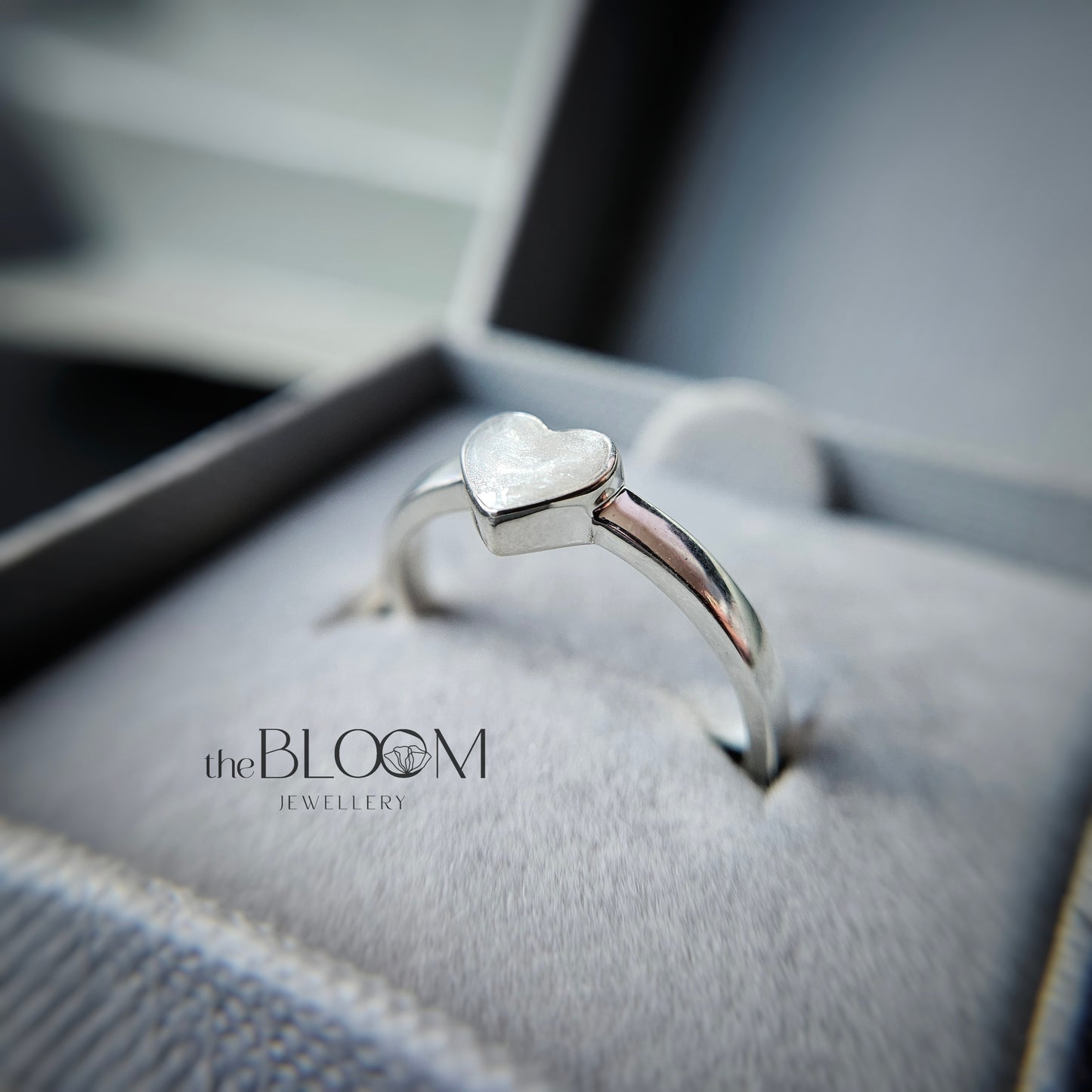 silver heart ring with ashes