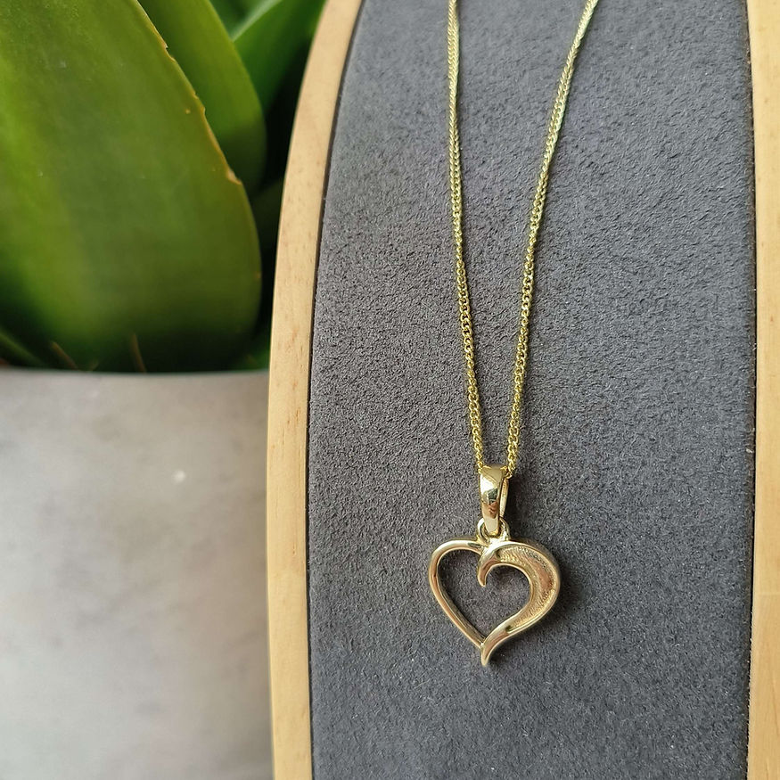 Gold heart necklace to hold ashes
