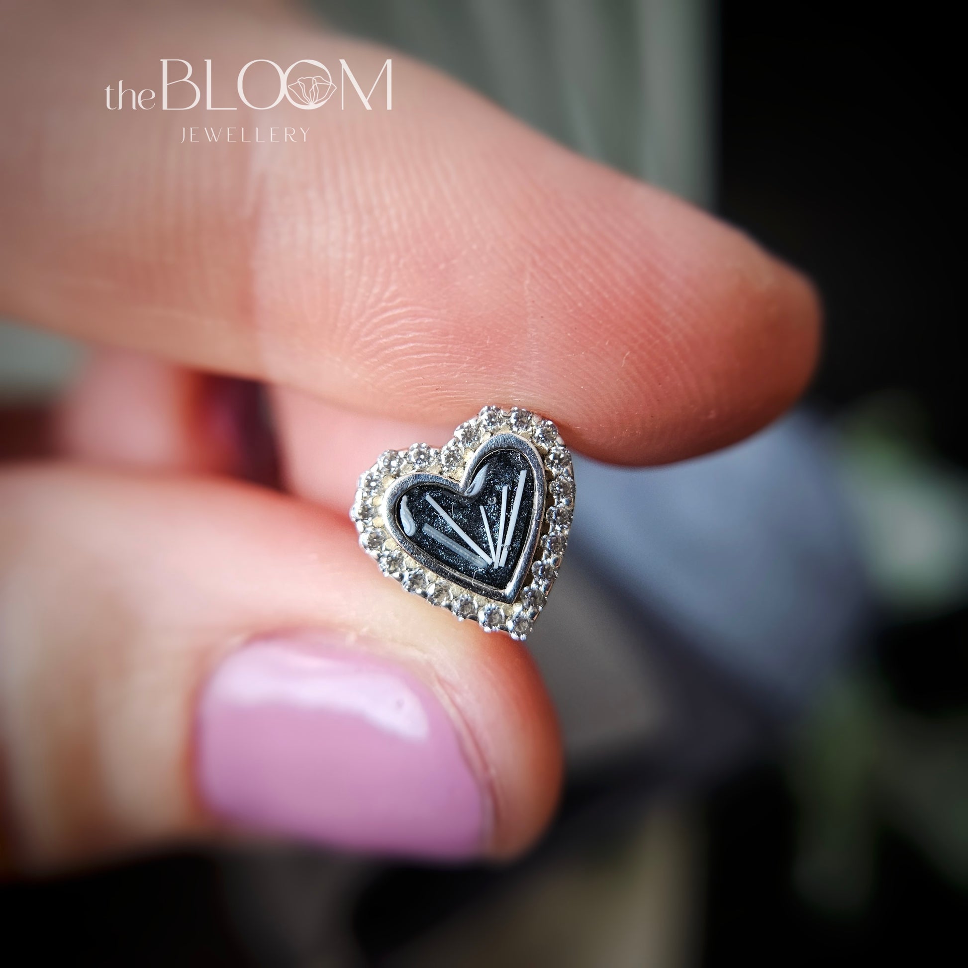 bracelet charm in shape of heart with fur inside the stone