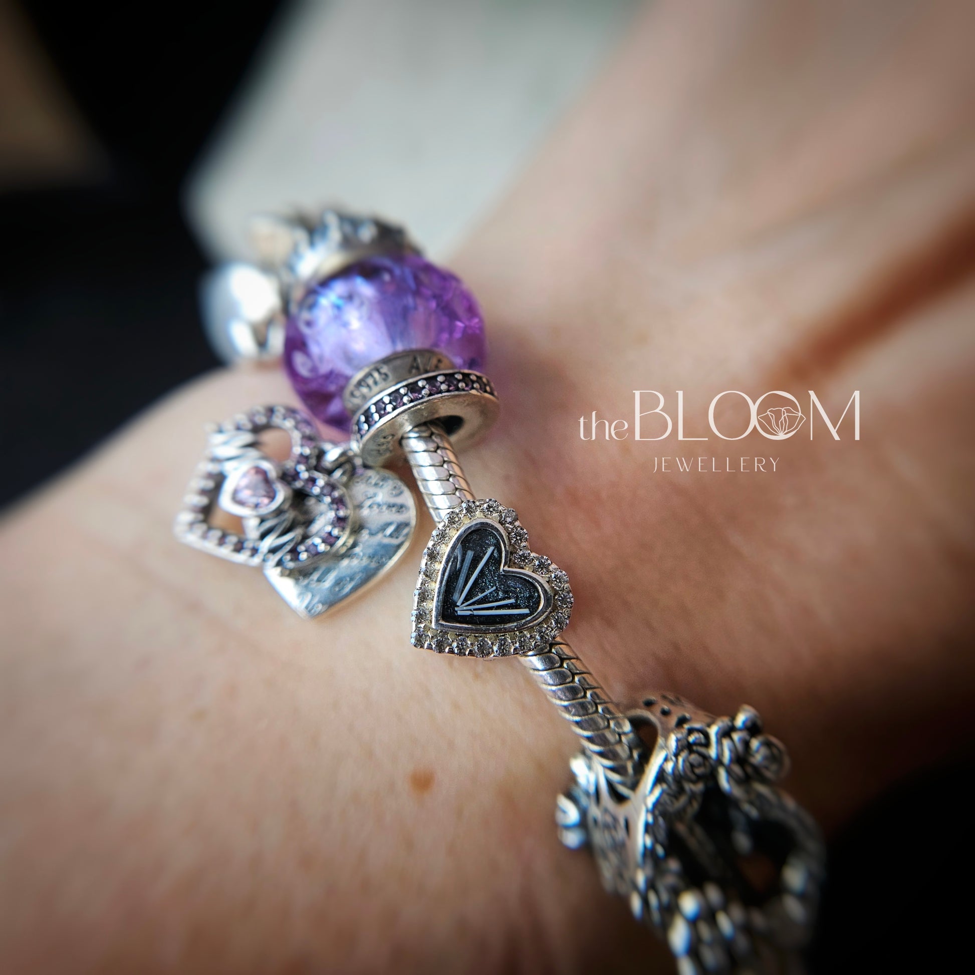 bracelet charm in shape of heart with fur inside the stone