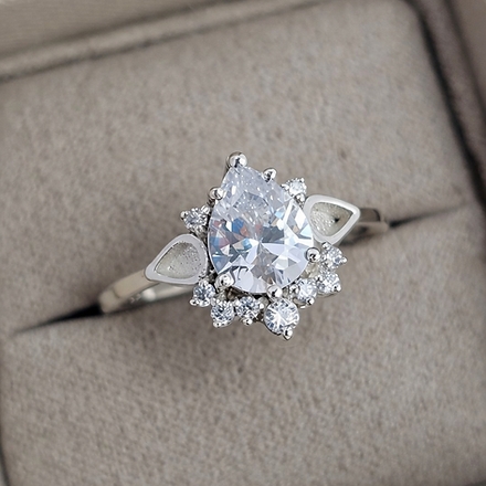 Silver ring with a large diamond in a box