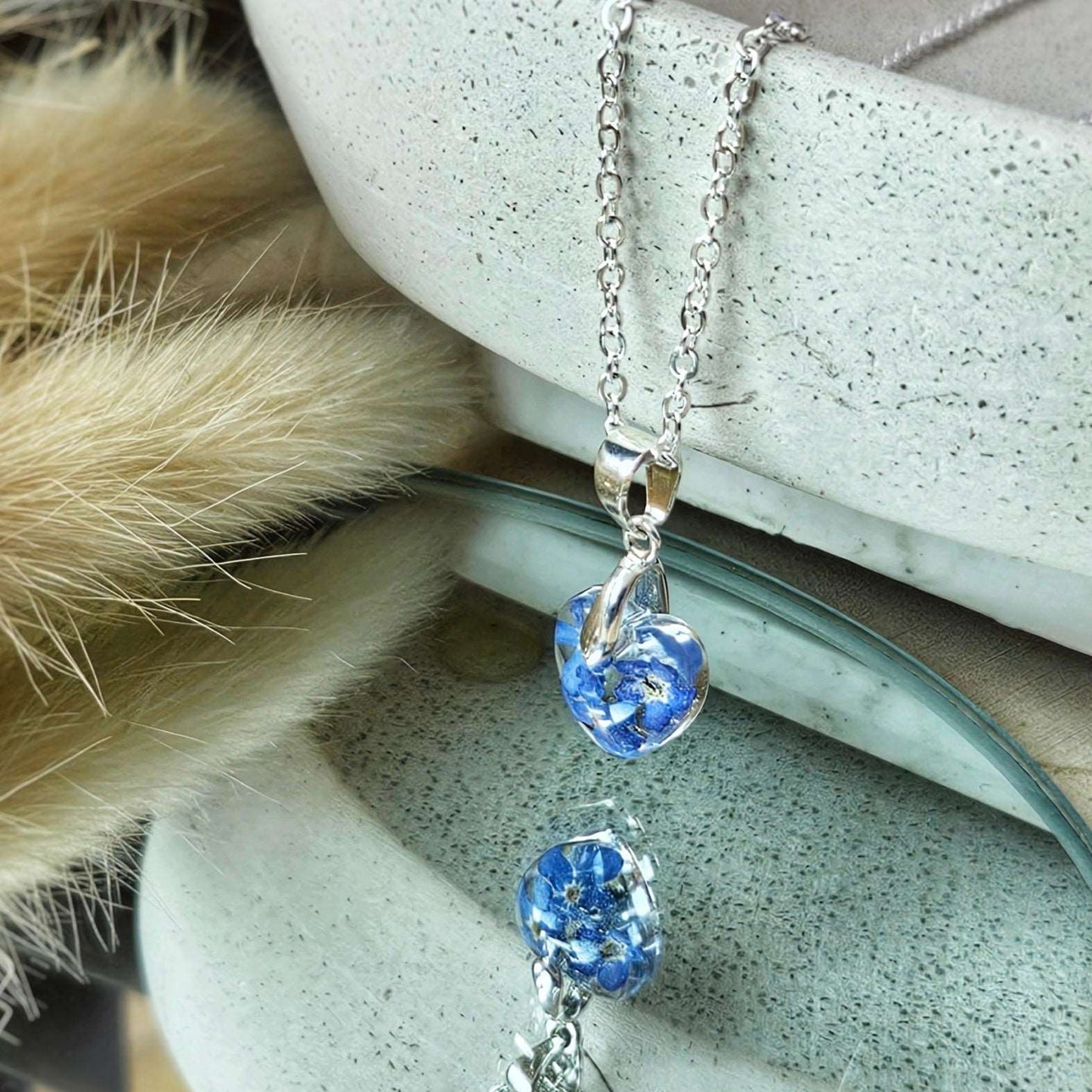 necklace with forget me not flowers