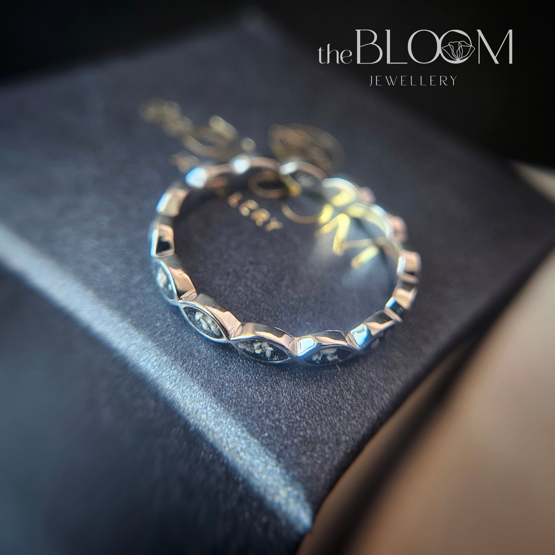 white gold ring with ashes