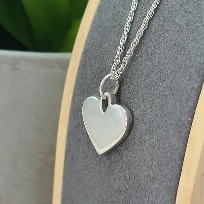 heart necklace with hand writing 